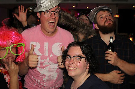 Afterparty photobooth picture with a bunch of Yoasties doing awkward expressions and having weird headgear.