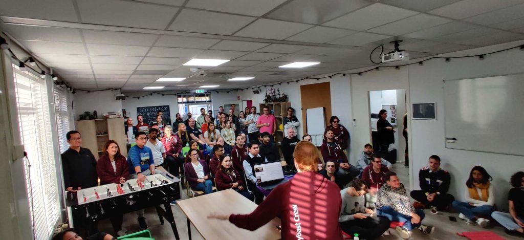 Full packed room of Yoast colleagues attending a talk from Jono.